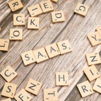 scrabble-letters-spelling-saas-on-a-wooden-tabl